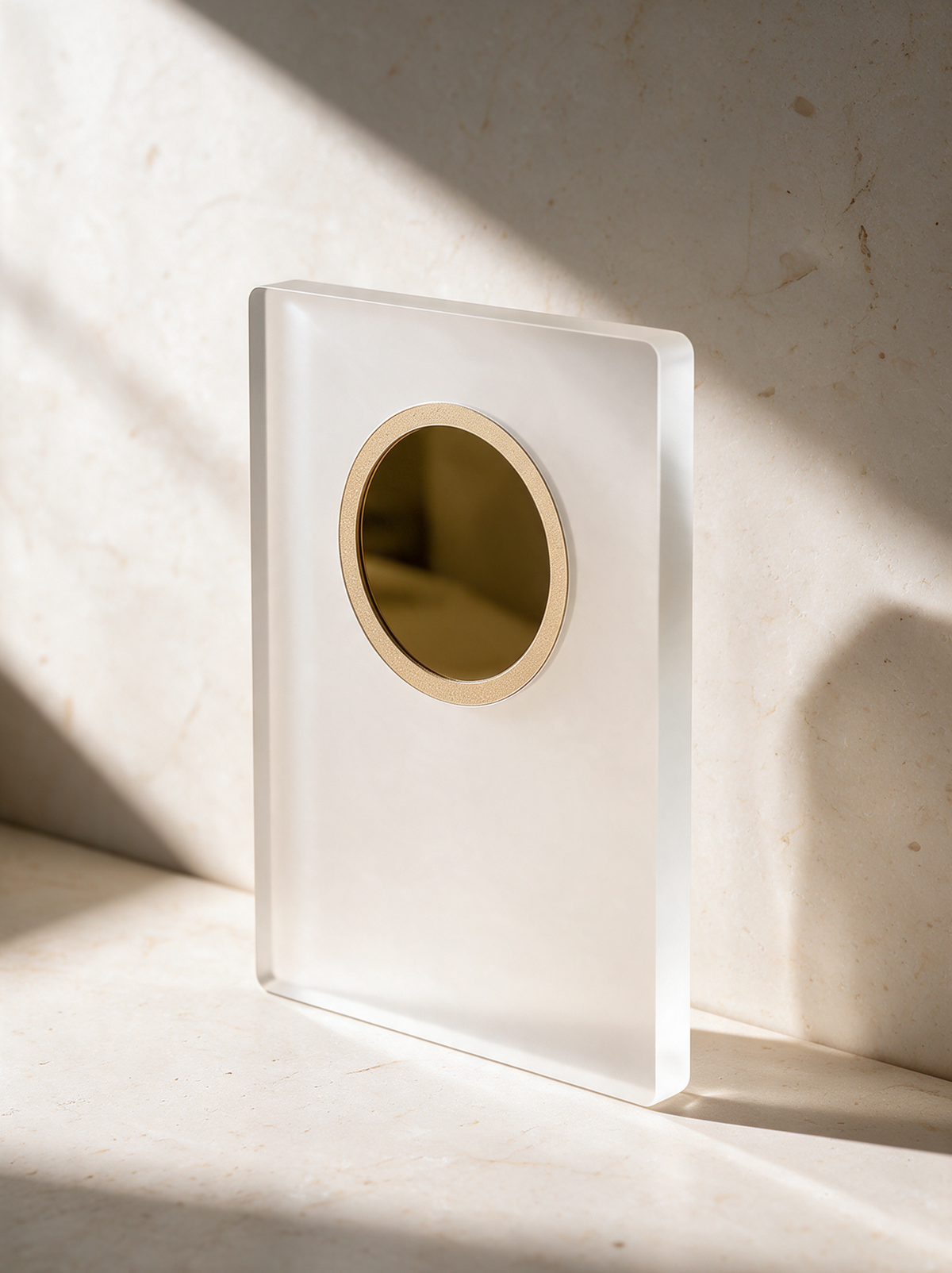 Frosty award, Gold medallion, on warm stone