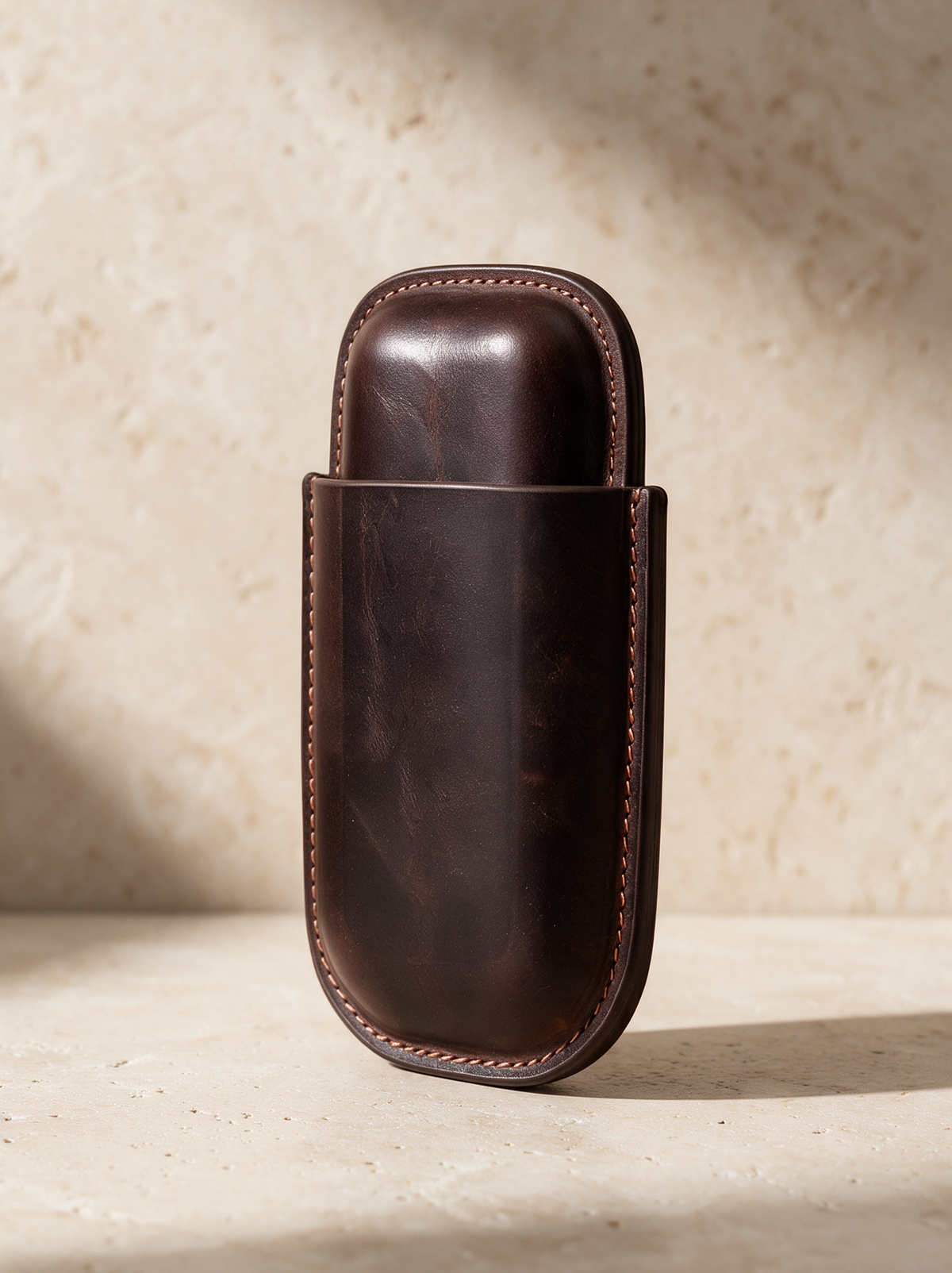 The Leather Cigar Case in a warm stone setting