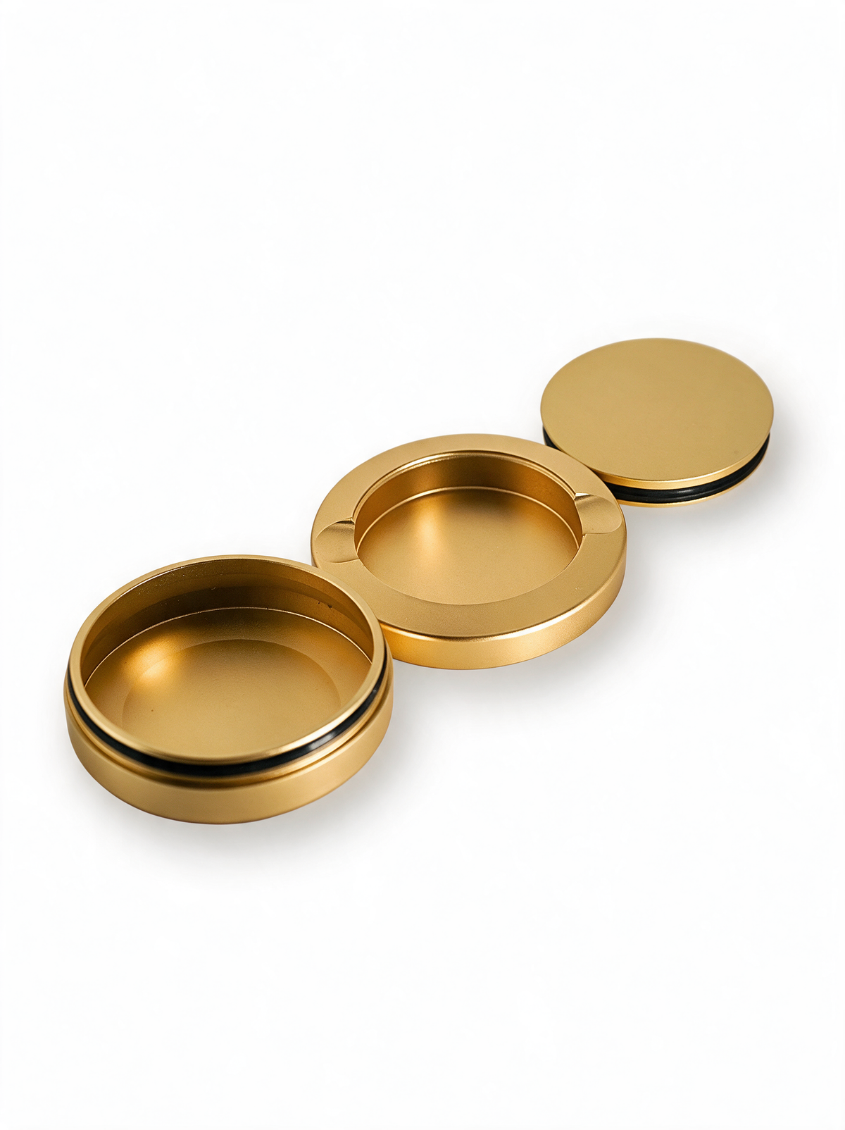 The Metal Can in gold, opened in its three parts