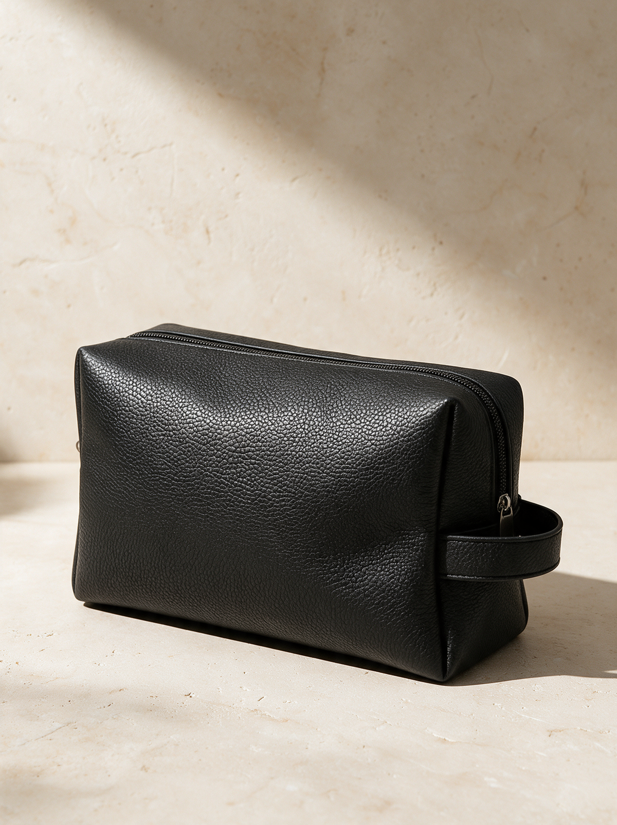 The Toiletry Bag in a warm stone setting